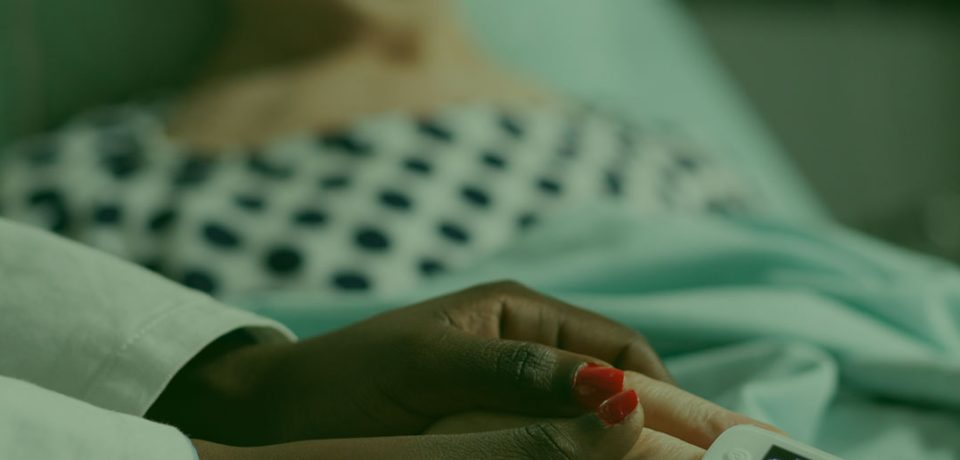 reynolds-caring-friendly-young-doctor-therapist-holding-sick-senior-patient-hand-comforting-showing-comapssion-talking-about-treatment-while-he-s-breathing-with-help-from-oxygen-mask